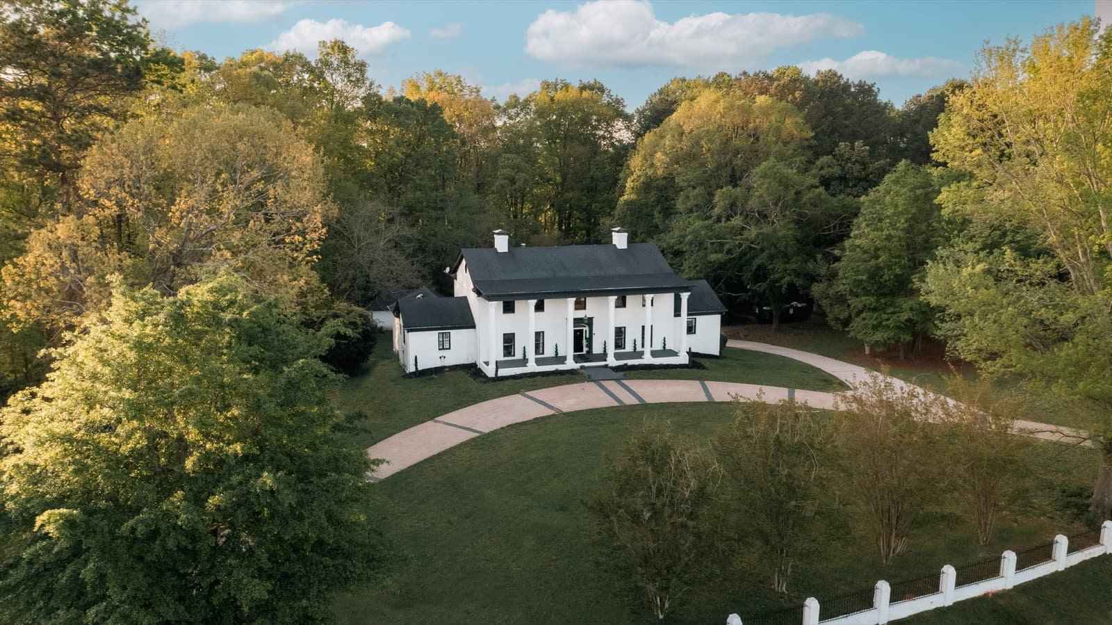 Aerial view of the estate and wooded grounds